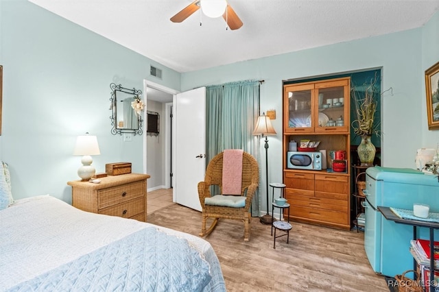 bedroom with hardwood / wood-style flooring and ceiling fan