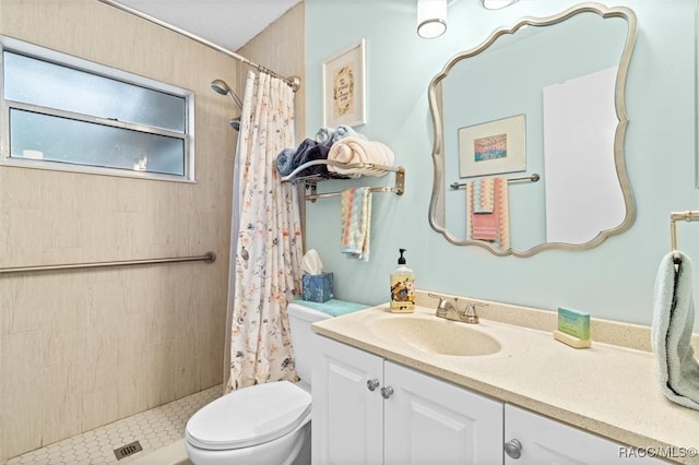 bathroom with a shower with curtain, vanity, and toilet