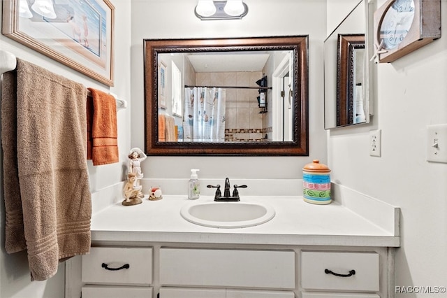 bathroom with vanity and a shower with shower curtain