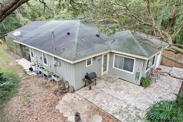 back of house with a patio