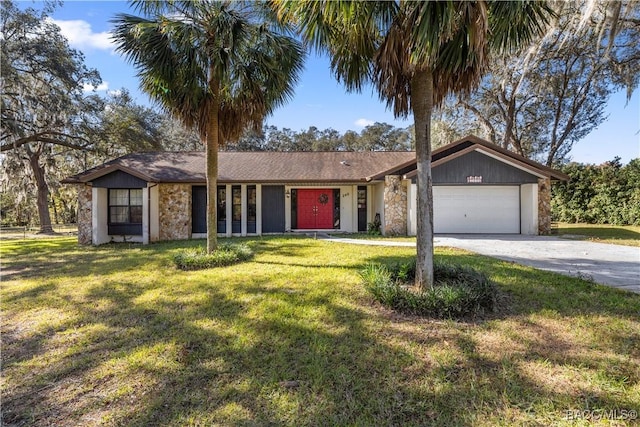 ranch-style house with a garage and a front lawn