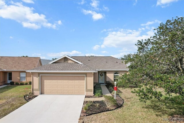 ranch-style house featuring a front yard and a garage