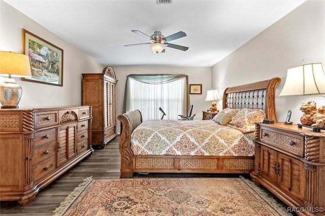 bedroom featuring ceiling fan and dark hardwood / wood-style flooring