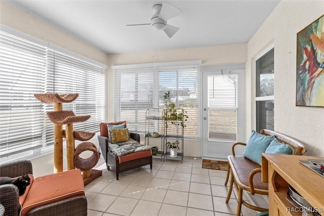 sunroom / solarium with ceiling fan and a healthy amount of sunlight