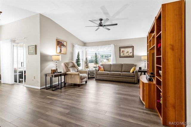 living room featuring ceiling fan, dark hardwood / wood-style flooring, and lofted ceiling