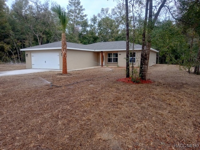 ranch-style house featuring a garage