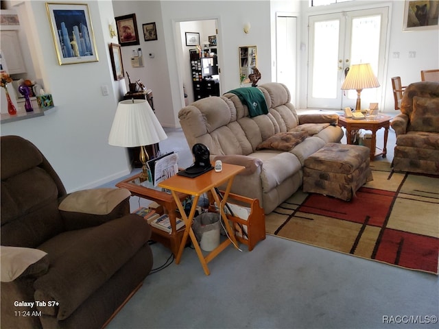 carpeted living room featuring french doors