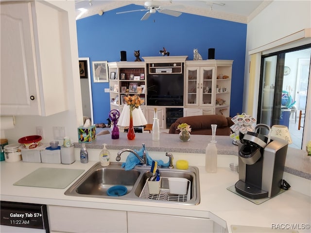 kitchen featuring white cabinetry, sink, ceiling fan, and ornamental molding