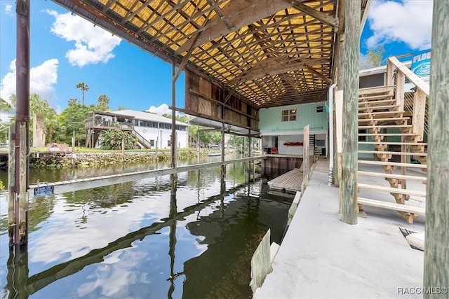 11615 N Caribee Pt, Inglis, FL 34449 - dock area featuring stairway and a water view
