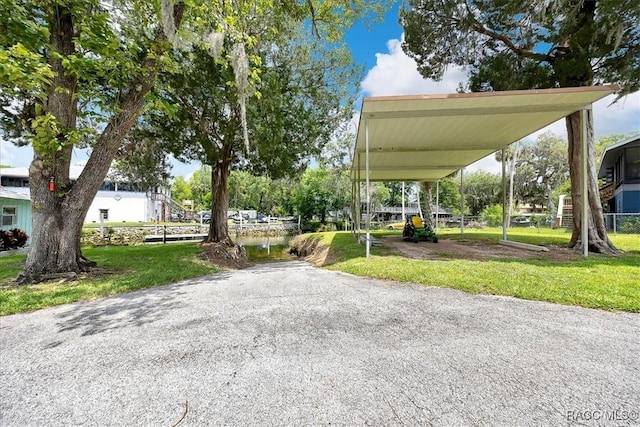 11615 N Caribee Pt, Inglis, FL 34449 - view of parking / parking lot featuring a carport