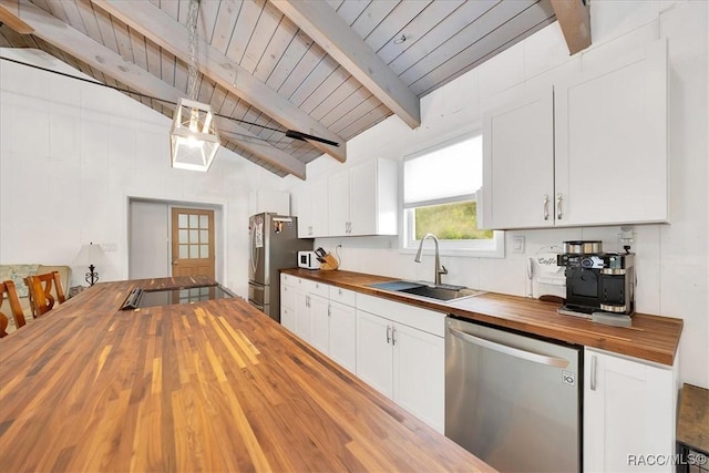 11615 N Caribee Pt, Inglis, FL 34449 - kitchen with butcher block counters, stainless steel appliances, a sink, white cabinets, and wooden ceiling