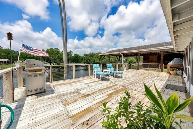 11615 N Caribee Pt, Inglis, FL 34449 - deck with a water view and area for grilling