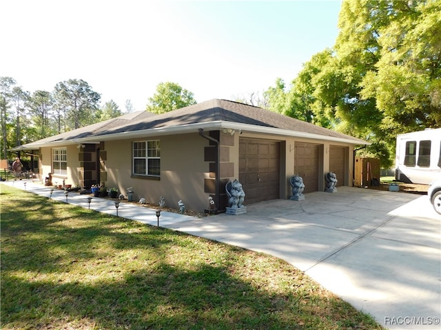 view of home's exterior with a yard and a garage