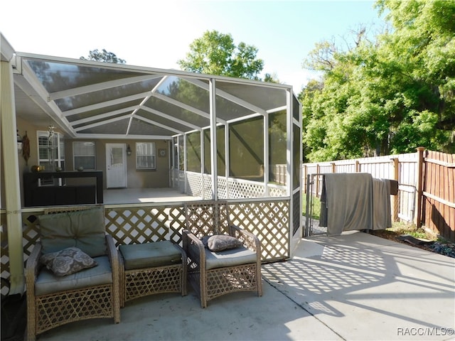 view of patio / terrace with a lanai