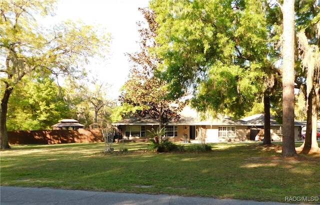 ranch-style house with a front yard