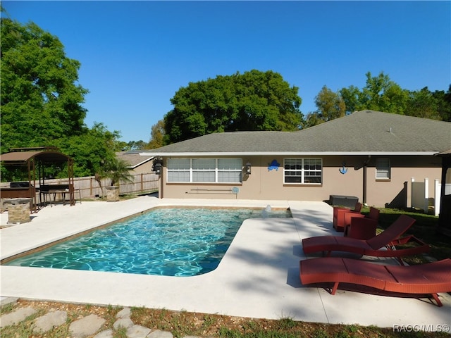 view of swimming pool with a patio