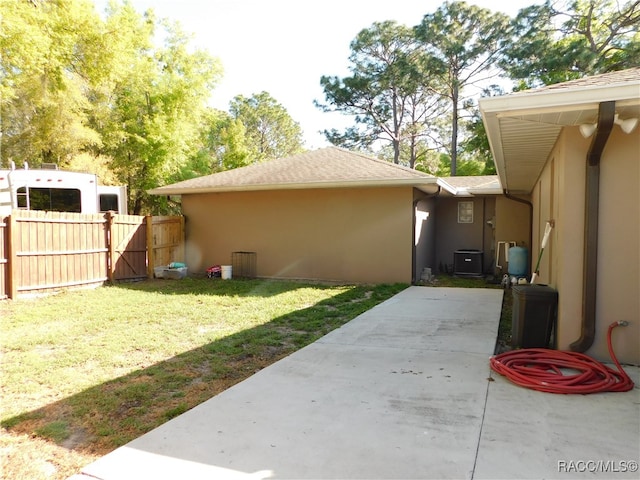 exterior space with a patio area and central air condition unit