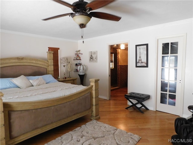 bedroom with ceiling fan, ornamental molding, and hardwood / wood-style flooring