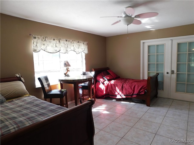 bedroom with french doors, light tile patterned floors, and ceiling fan