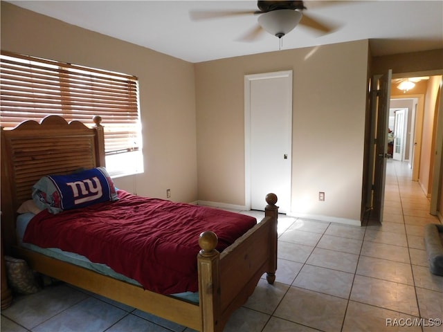 bedroom with light tile patterned floors and ceiling fan