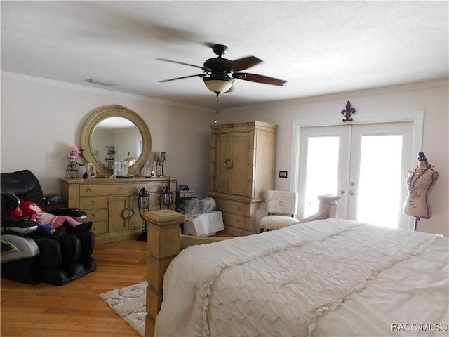 bedroom with ceiling fan, crown molding, french doors, and light wood-type flooring