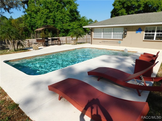 view of swimming pool with a patio area