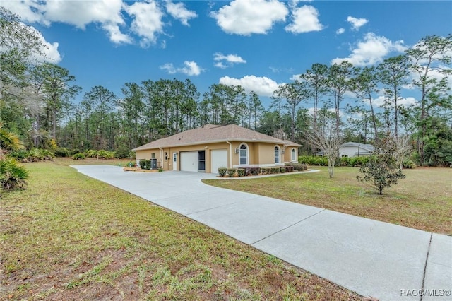 ranch-style house featuring a front lawn and a garage