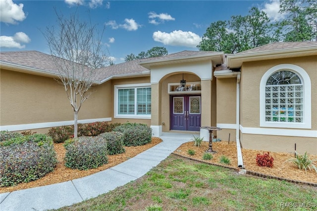 5281 W Cisco St, Beverly Hills, FL 34465 - view of exterior entry with stucco siding