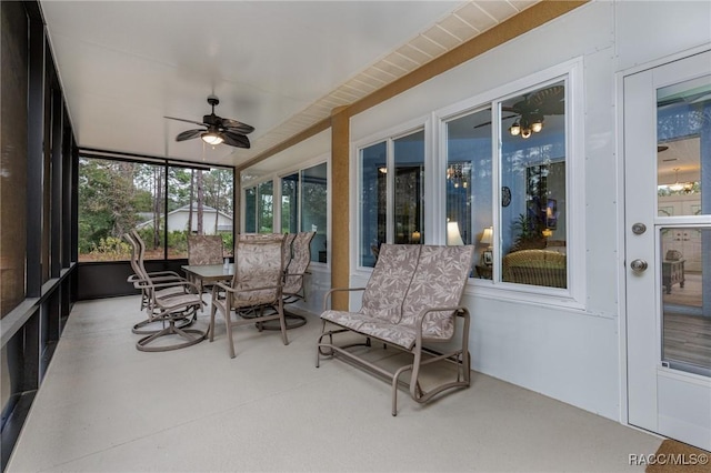 sunroom featuring ceiling fan