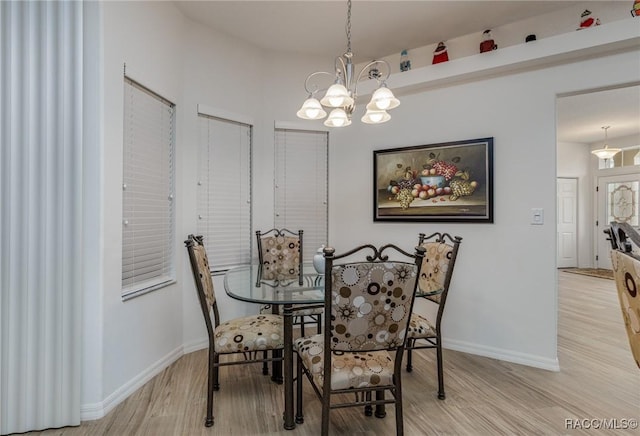 5281 W Cisco St, Beverly Hills, FL 34465 - dining room with a chandelier and light wood-style floors