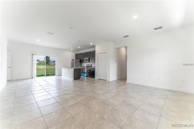10089 N Athenia Dr, Citrus Springs, FL 34434 - unfurnished living room featuring recessed lighting, light tile patterned floors, and baseboards