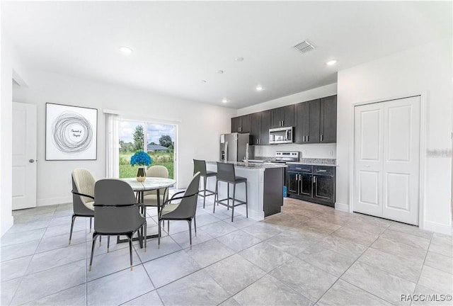 10089 N Athenia Dr, Citrus Springs, FL 34434 - dining area with recessed lighting, light tile patterned flooring, and baseboards
