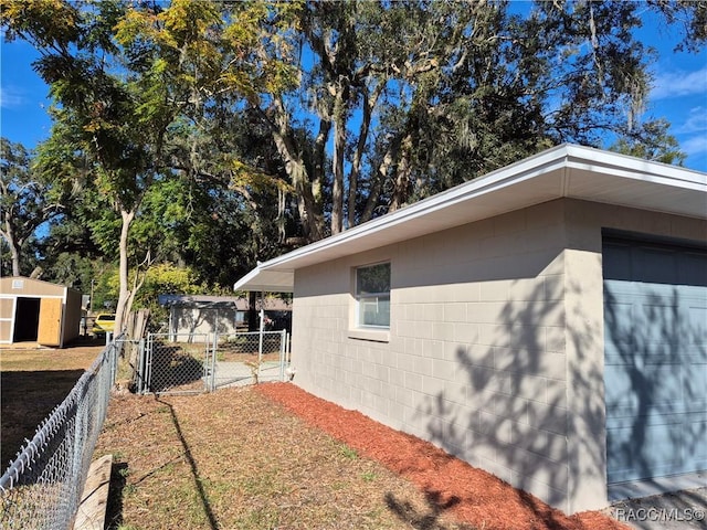 view of home's exterior featuring a garage and an outdoor structure