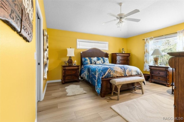 bedroom featuring ceiling fan and light hardwood / wood-style flooring