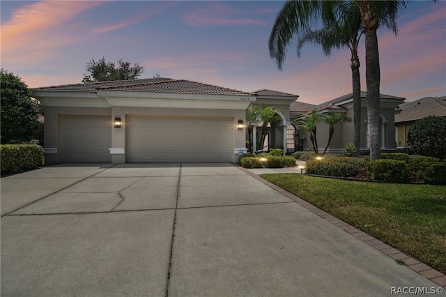 view of front of property with a garage