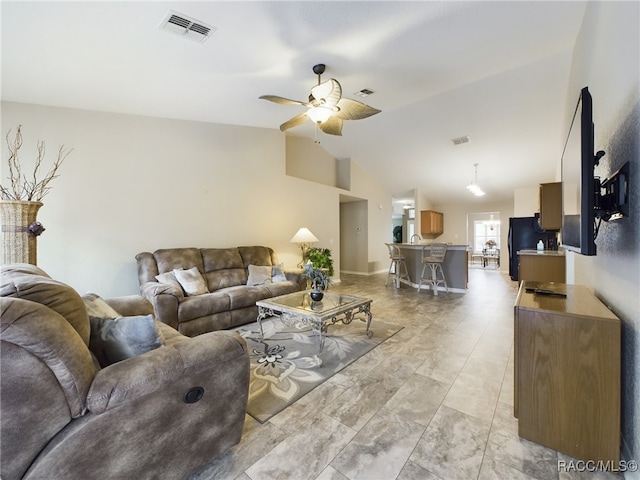 living room with lofted ceiling and ceiling fan