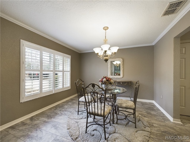 dining area with ornamental molding, a chandelier, and a textured ceiling