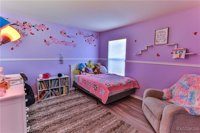 10 Greentree St, Homosassa, FL 34446 - bedroom featuring baseboards and wood finished floors