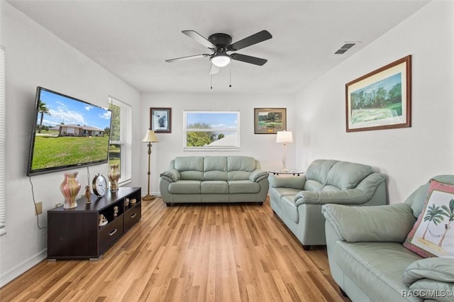 834 E Boston St, Hernando, FL 34442 - living area with light wood-style floors, ceiling fan, and baseboards