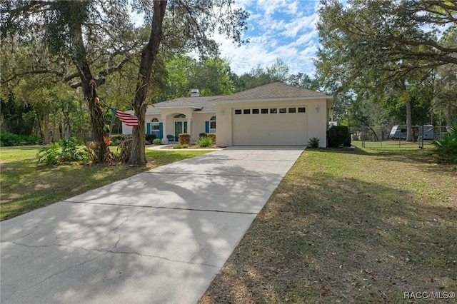 view of front of home featuring a garage and a front yard