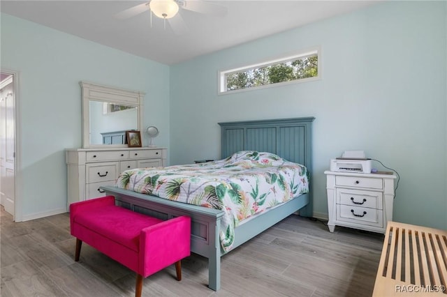 bedroom featuring ceiling fan and light hardwood / wood-style flooring