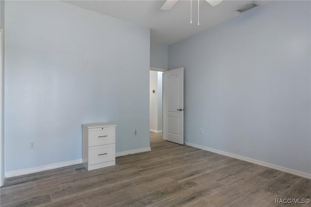 unfurnished room with hardwood / wood-style flooring and ceiling fan