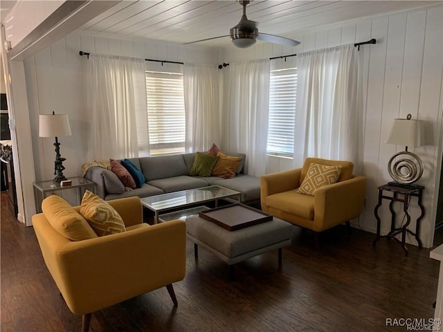 living area featuring dark wood-style flooring, plenty of natural light, and ceiling fan