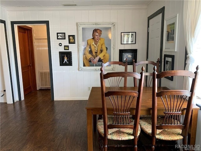 dining area featuring ornamental molding, dark wood finished floors, and visible vents