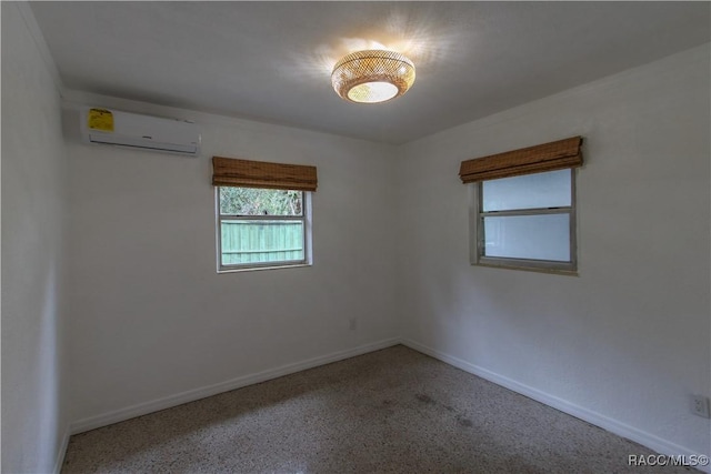 unfurnished room with a wall mounted air conditioner