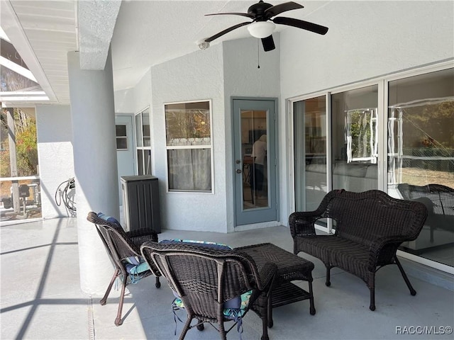 view of patio featuring ceiling fan