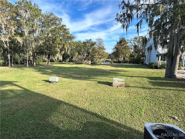 view of yard featuring central AC unit