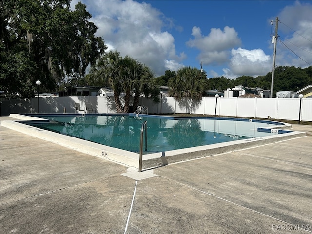 view of swimming pool featuring a patio