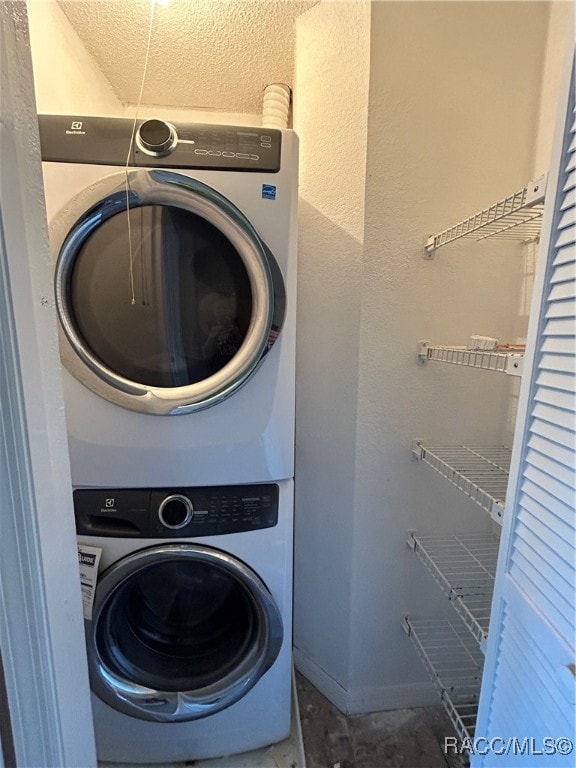 laundry room with stacked washer and dryer