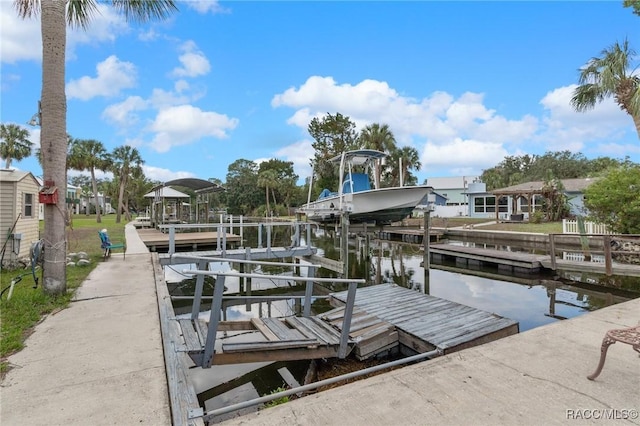 view of dock with a water view and boat lift